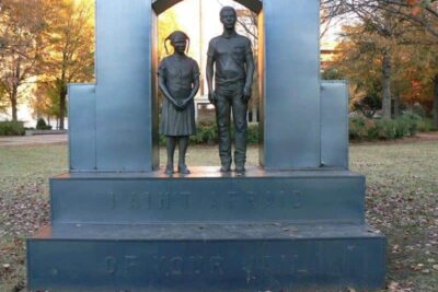 Statue in Kelly Ingram Park, Birmingham, with the inscription, 'We aint' afraid of your jail.'