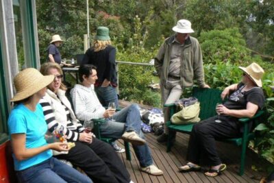 Everyone wears floppy hats while sitting in the Australian sun.