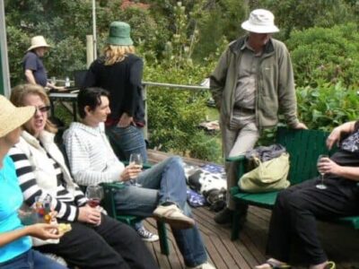 Everyone wears floppy hats while sitting in the Australian sun.
