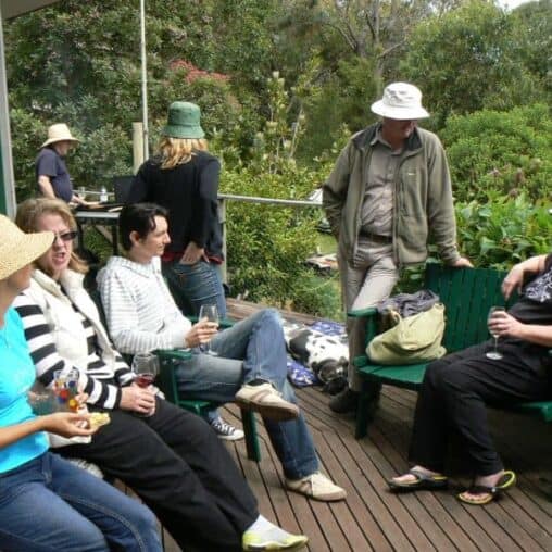 Everyone wears floppy hats while sitting in the Australian sun.