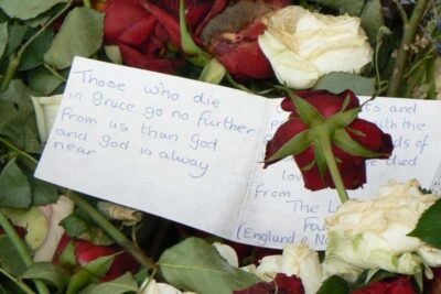 Note with the thousands of flowers left in memoriam at the Cathedral near where the bombing took place in Oslo in July.
