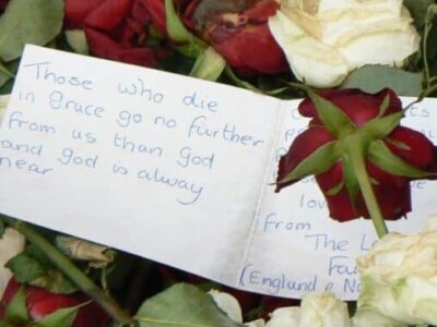 Note with the thousands of flowers left in memoriam at the Cathedral near where the bombing took place in Oslo in July.