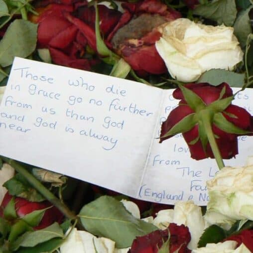 Note with the thousands of flowers left in memoriam at the Cathedral near where the bombing took place in Oslo in July.