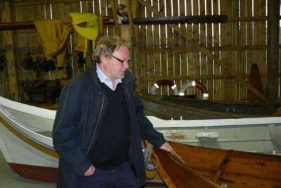 Ornulf Opdahl with his wooden boats in Godoy, Norway.