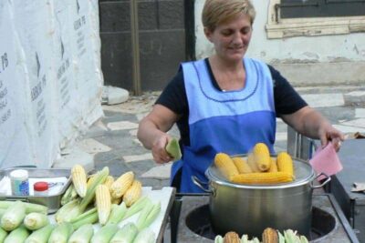 Corn seller in Zagreb, Croatia. People never eat corn at home, only on the streets.