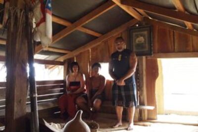 Judy, her grandson, and Hone at the Maori ceremony.