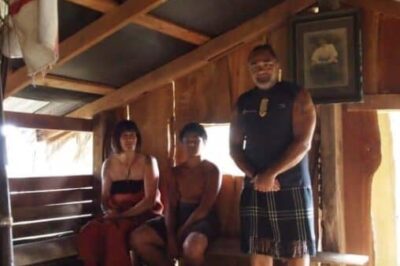 Judy, her grandson, and Hone at the Maori ceremony.