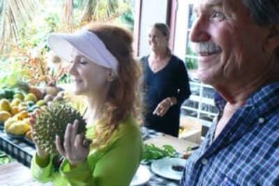 Lilly and Chuck with a happy customer at Ono Organic Farms, Hana Maui.