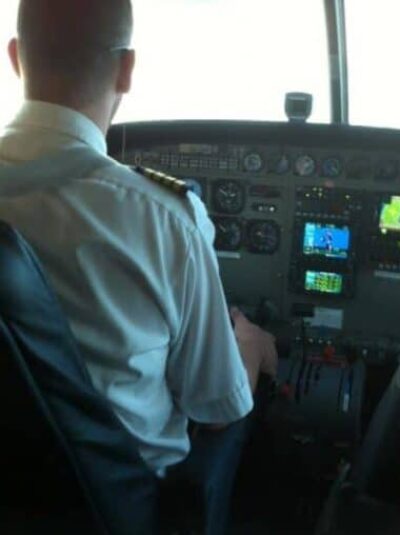 Our Mokulele Airlines pilot Bob, flying to Molokai. No need to close the door.
