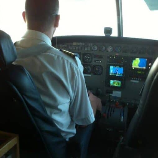 Our Mokulele Airlines pilot Bob, flying to Molokai. No need to close the door.