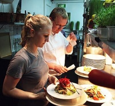Bob Pollitt, of Matakana Market Kitchen, New Zealand, preparing a plate.