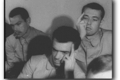 USS Pueblo crewmen showing their N. Korean captors the "Hawaiian Good Luck Sign."