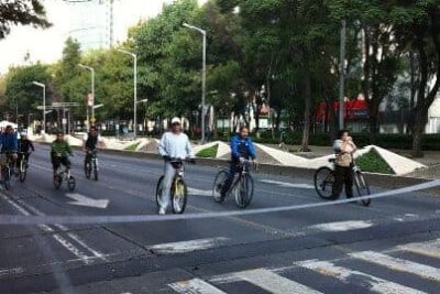 Mexico City bike riders wait for the light on the car-free Reforma boulevard.