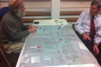 South Deerfield resident Ken Schoen talks with a planner about the village.