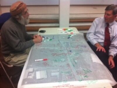 South Deerfield resident Ken Schoen talks with a planner about the village.