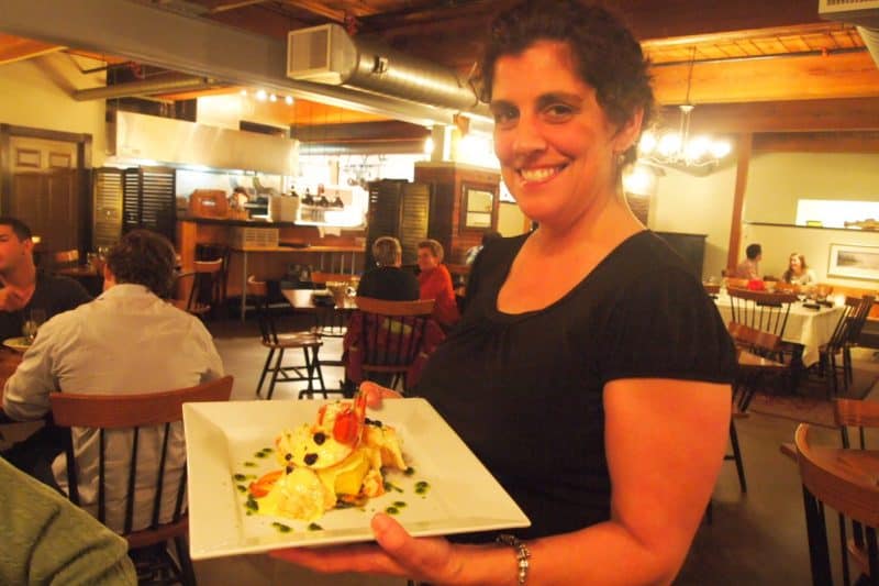 Karen Johnson serves up a plate of lazy lobster at Fishbones in Lewiston. 