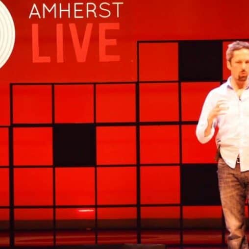 Oliver Broudy, founder of Amherst LIVE, on stage Saturday night at Amherst College.