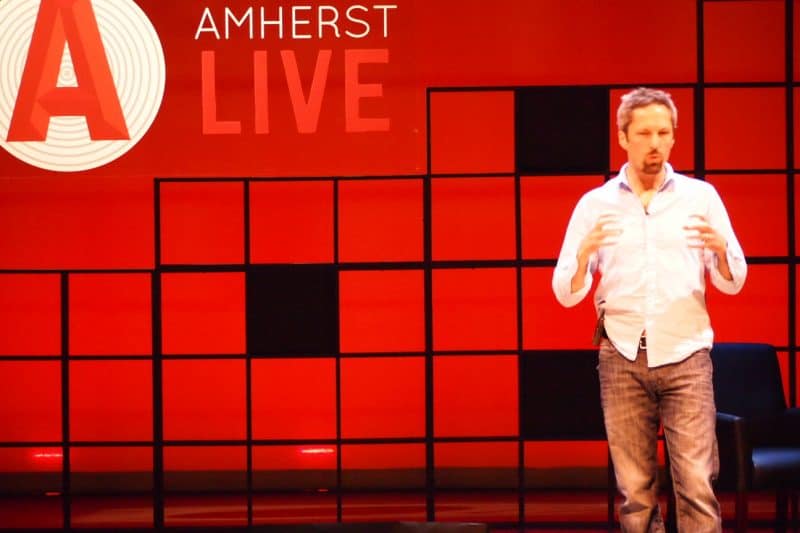 Oliver Broudy, founder of Amherst LIVE, on stage Saturday night at Amherst College.