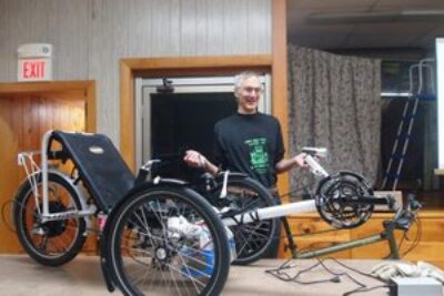 Peter Talmage owns two electric bikes, one a recumbent and another the enclosed ELF bike.