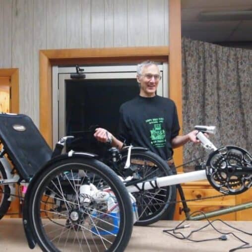 Peter Talmage owns two electric bikes, one a recumbent and another the enclosed ELF bike.