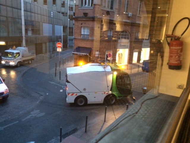 Vacuum trucks take care of whatever is left after the hoses have passed over the streets in Toulouse.