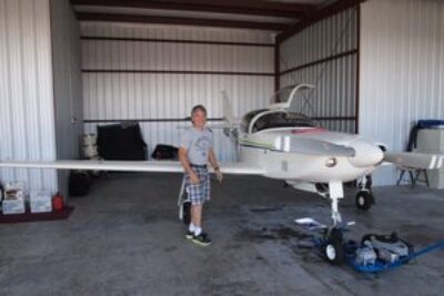 Bruce's plane in his hangar, doing the pre-check before take-off.
