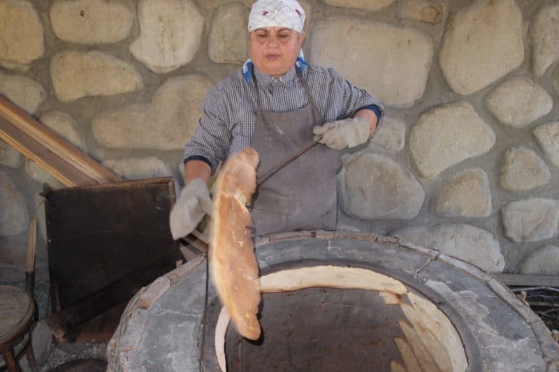 Fresh wheat bread is made in this clay oven at Pheasant's Tale restaurant.