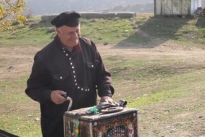 A friendly accordian man outside Mtskheta Church.