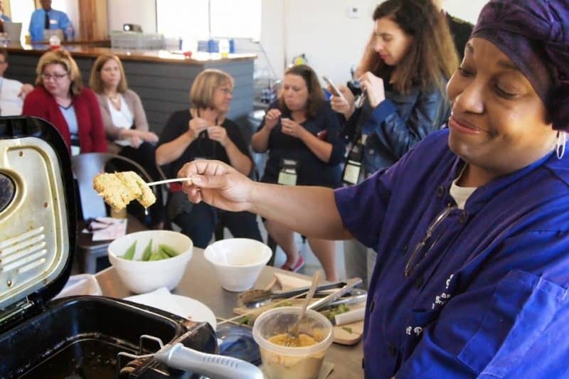 Chef Pandarina Soumas demonstrates how she fries okra at the Sainte Terre event and wedding venue in Benton, Louisiana.