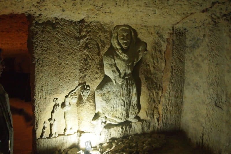 Carvings in the limestone cave at Dom. Bouillon-Dorleans.