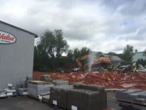This old yellow house has stood next to the Leader Home Center in Deerfield for decades. Today it was torn down, to make way for a new store building. 
