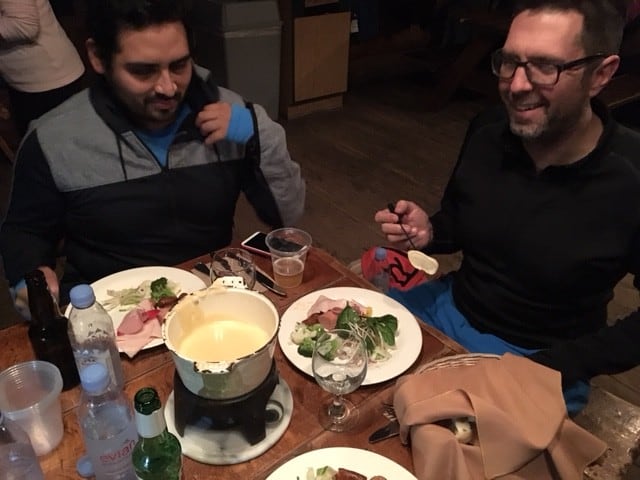Enjoying cheese fondue in the high altitude Refuge de Trappeurs at Mont Tremblant.
