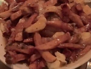 This poutine is simply fries, gravy and cheese curds, at L
