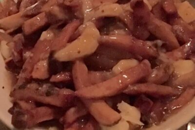 This poutine is simply fries, gravy and cheese curds, at L