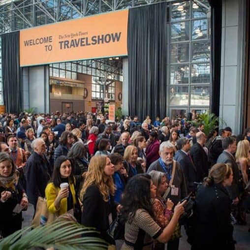 There's always a big line of travelers waiting to walk the aisles and see the attractions at the travel show.