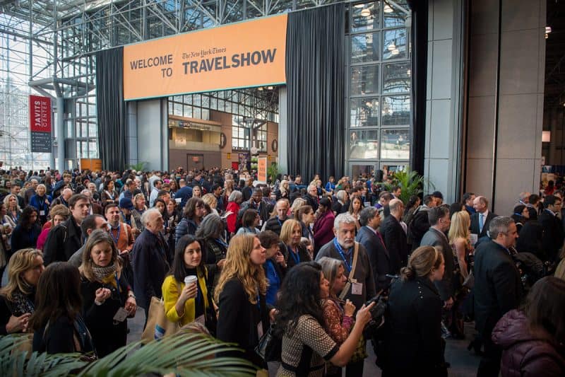 There's always a big line of travelers waiting to walk the aisles and see the attractions at the travel show.