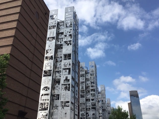 Seven steel towers show images drawn by schoolkids along the Buffalo Bayou trail in Houston.