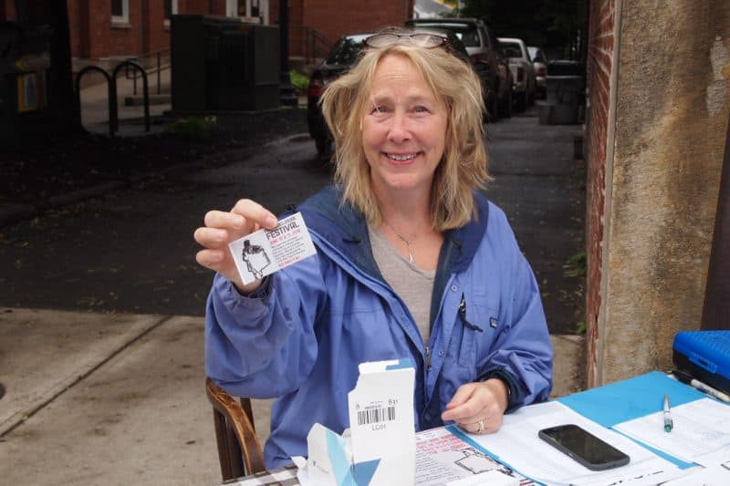 Linda McInerney selling tickets for her Full Disclosure Festival last night outside the Arts Block. 
