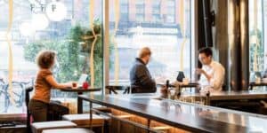 Inside the restaurant DBGB in New York City, workers enjoy the space while the restaurant is closed, and they pay to use it. 