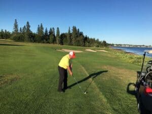 Jason Porter pretends to tee off at the Algonquin Hotel