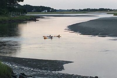 Floating down the Ogunquit river to the ocean at Ogunquit Beach, Maine.