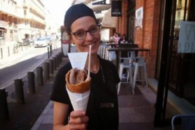 A cone of fois gras and bread in Toulouse, France.