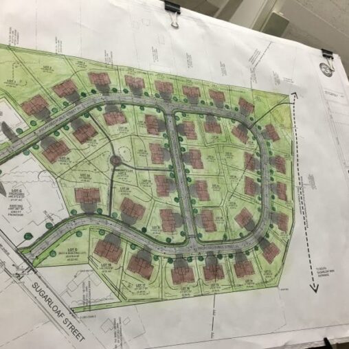 The plan calls for 36 two-family houses on the 22 acres of land near Mountain Road and Sugarloaf St, that's currently farmland.