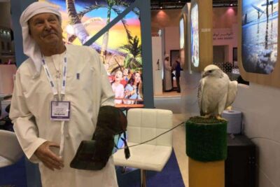 A falcon and his handler in the Dubai stand at WTM, London.
