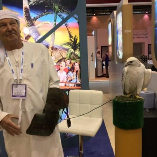 A falcon and his handler in the Dubai stand at WTM, London.