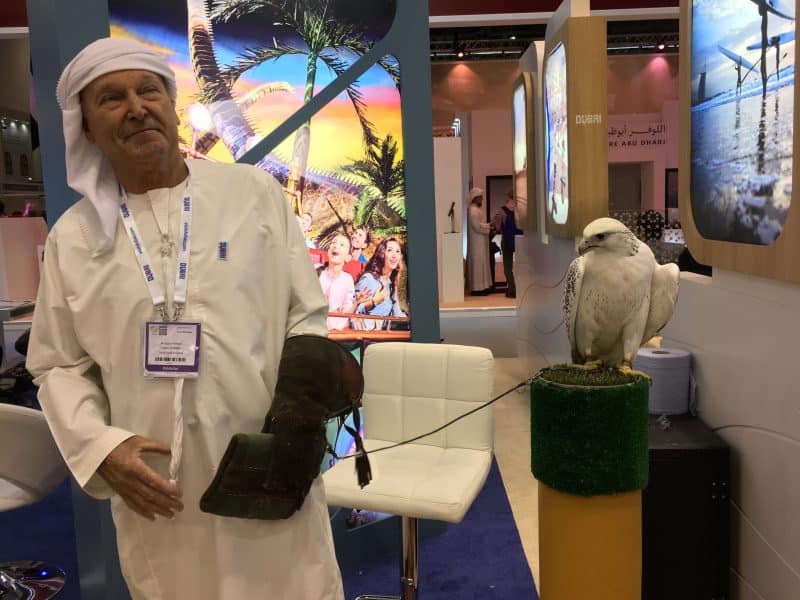 A falcon and his handler in the Dubai stand at WTM, London.
