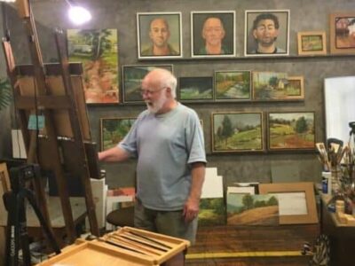 A painter working on oils at Lowe Mills.