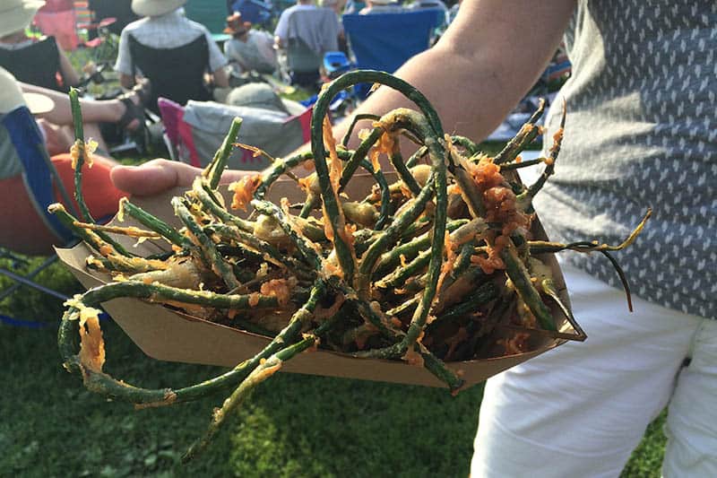 Garlic scapes for sale at the Festival, just one of the many local foods you can enjoy. 