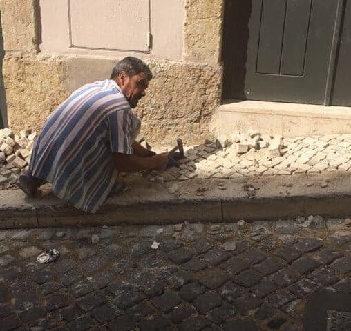 Low paid calceteiros are the men who create the works of art on Lisbon's sidewalks.