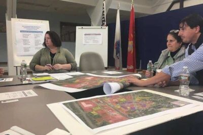 Jessica Atwood, center, of FRCOG discusses how to make South Deerfield a better place for businesses at a recent meeting at Town Hall.